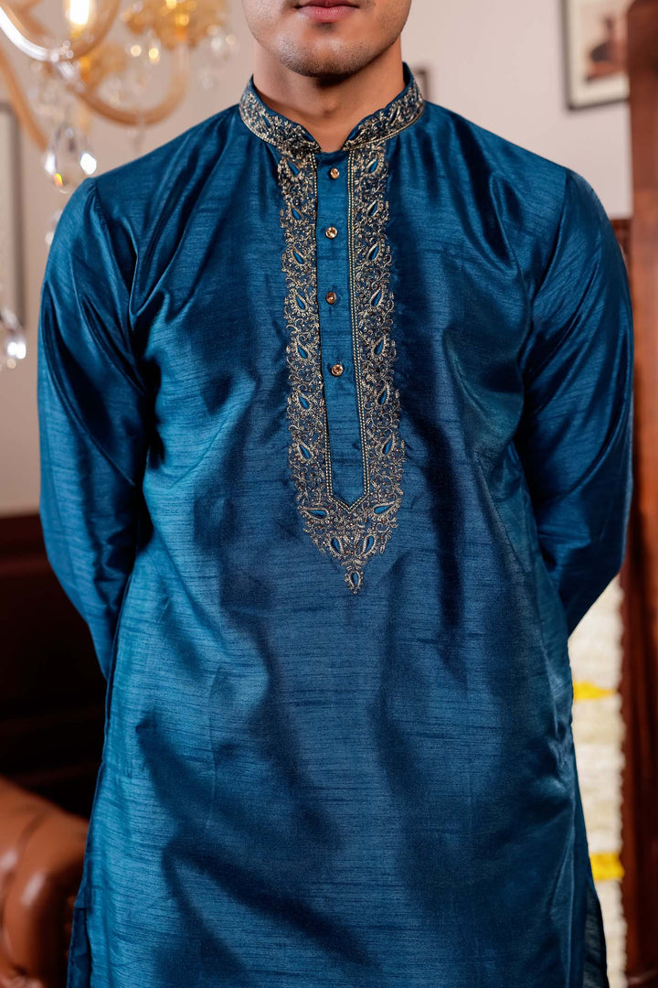 Midnight Blue Raw Silk Kurta Suit with Intricate Embroidery on neckline.