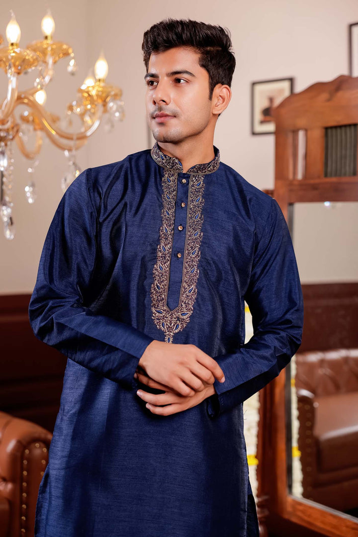 Navy Blue Raw Silk Kurta Suit with Intricate Embroidery on neckline.