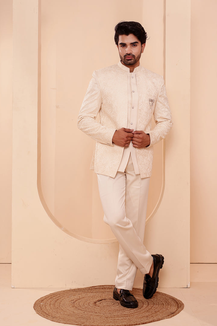 Cream Heavy Embroidered 3pcs Jacket Style Jodhpuri Suit.