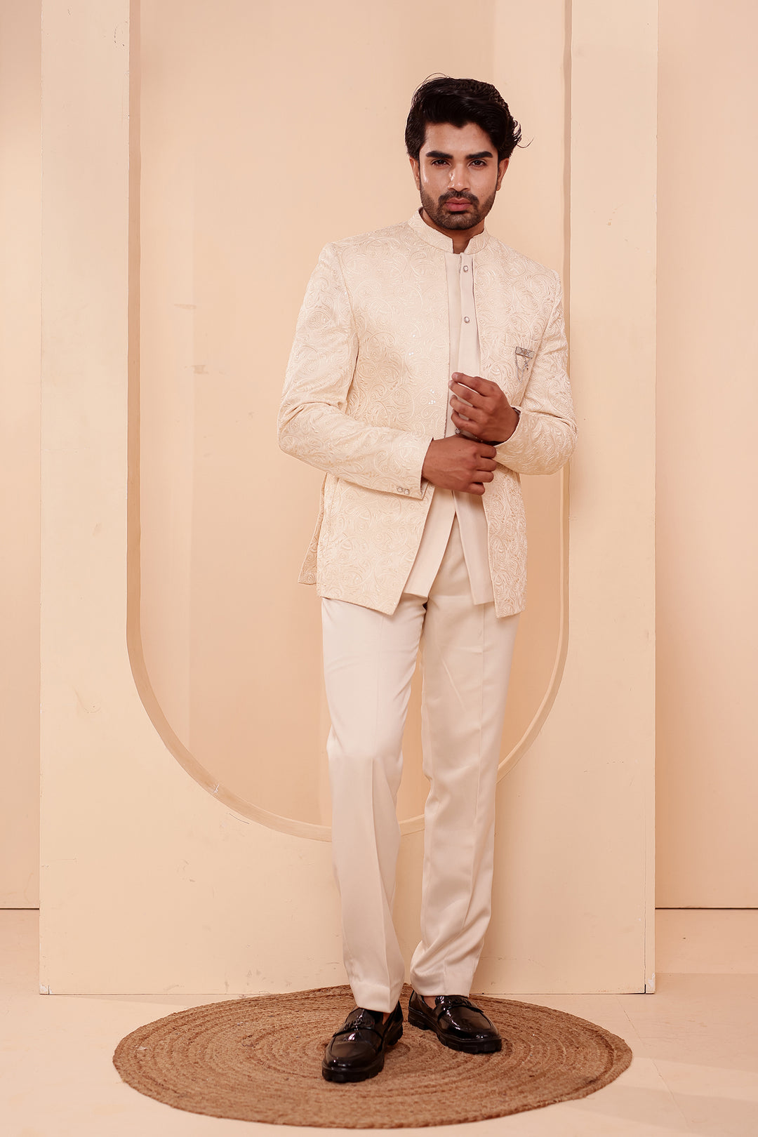 Cream Heavy Embroidered 3pcs Jacket Style Jodhpuri Suit.