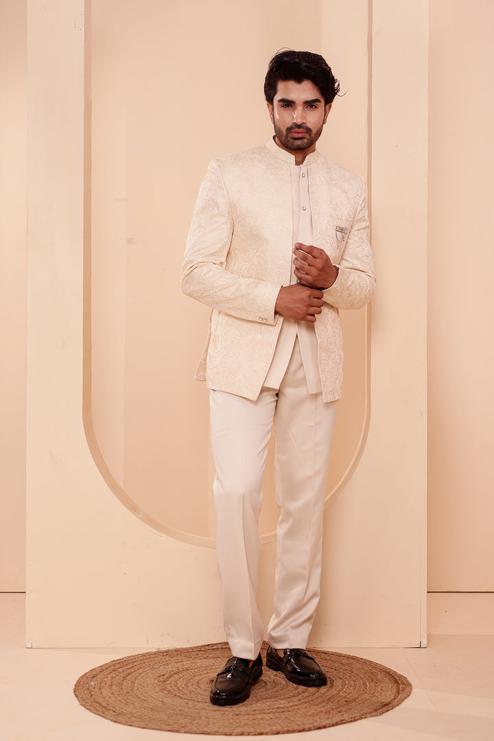 Cream Heavy Embroidered 3pcs Jacket Style Jodhpuri Suit.