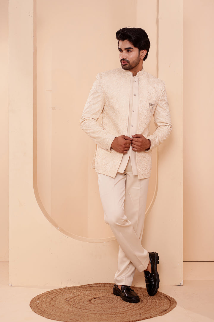 Cream Heavy Embroidered 3pcs Jacket Style Jodhpuri Suit.