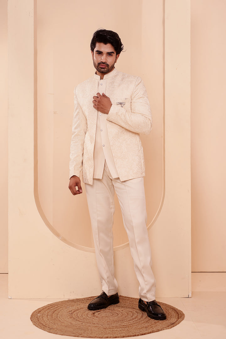 Cream Heavy Embroidered 3pcs Jacket Style Jodhpuri Suit.