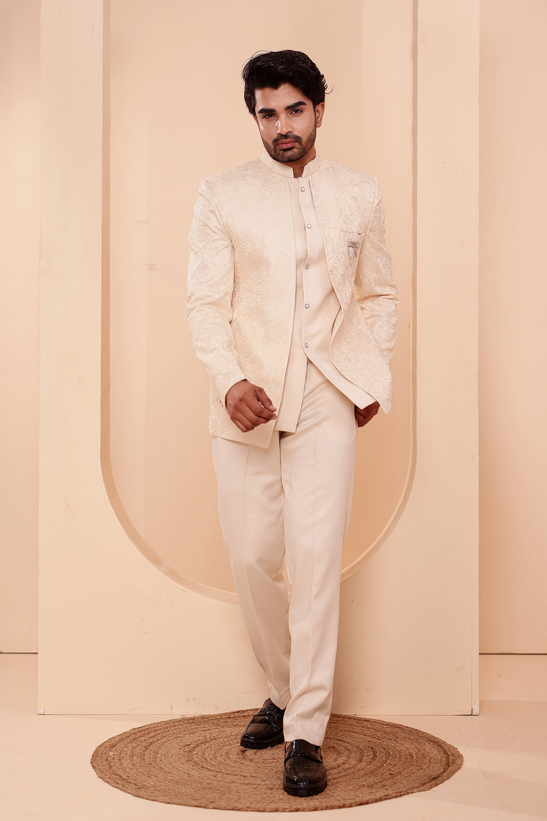 Cream Heavy Embroidered 3pcs Jacket Style Jodhpuri Suit.