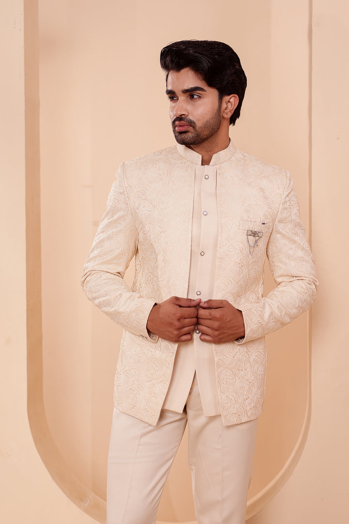Cream Heavy Embroidered 3pcs Jacket Style Jodhpuri Suit.