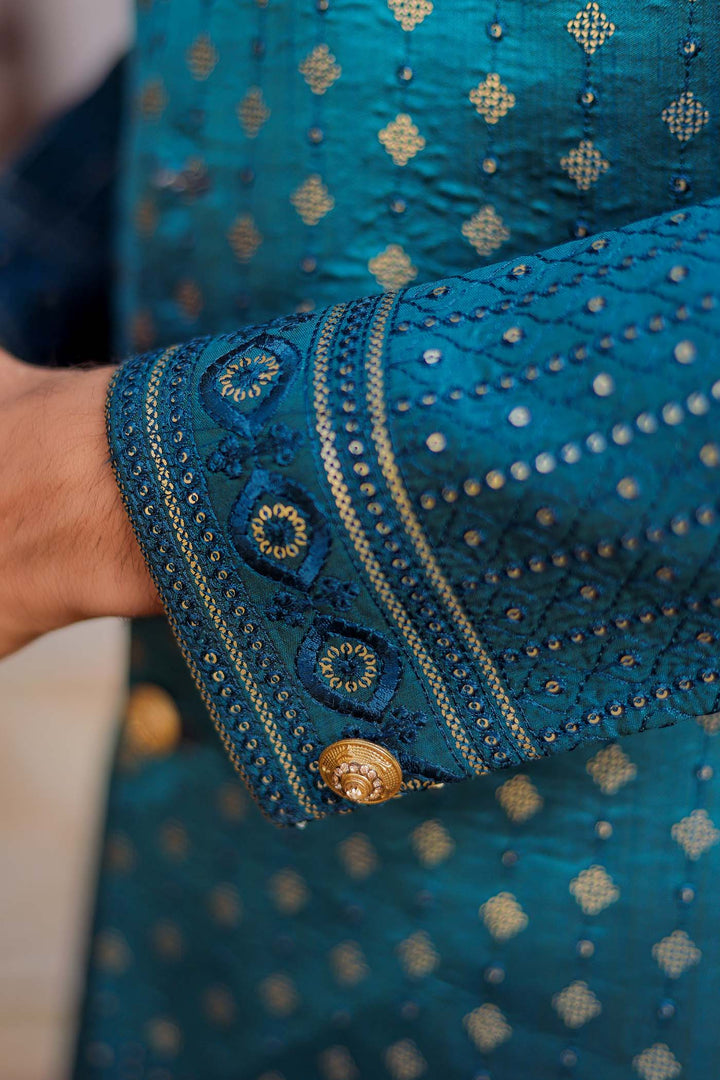 Teal Raw Silk Indo-Western Suit Embroidered With Gold Sequin And Resham Thread.