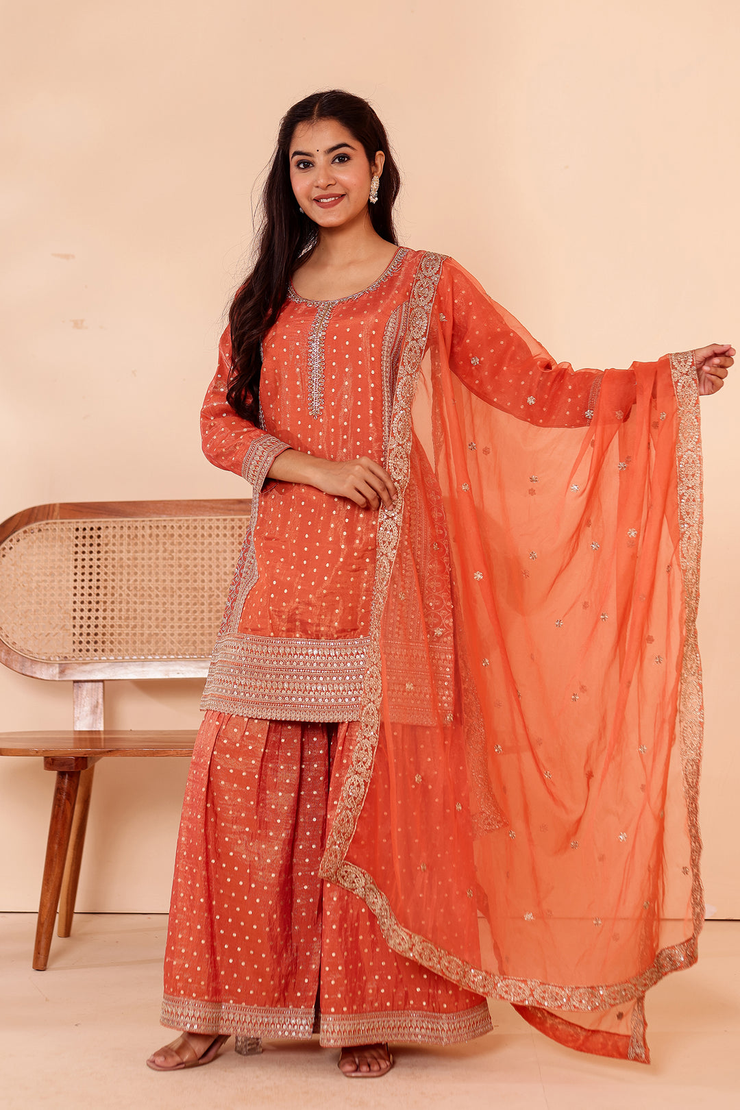 Rust Shimer Butti Sharara Suit.