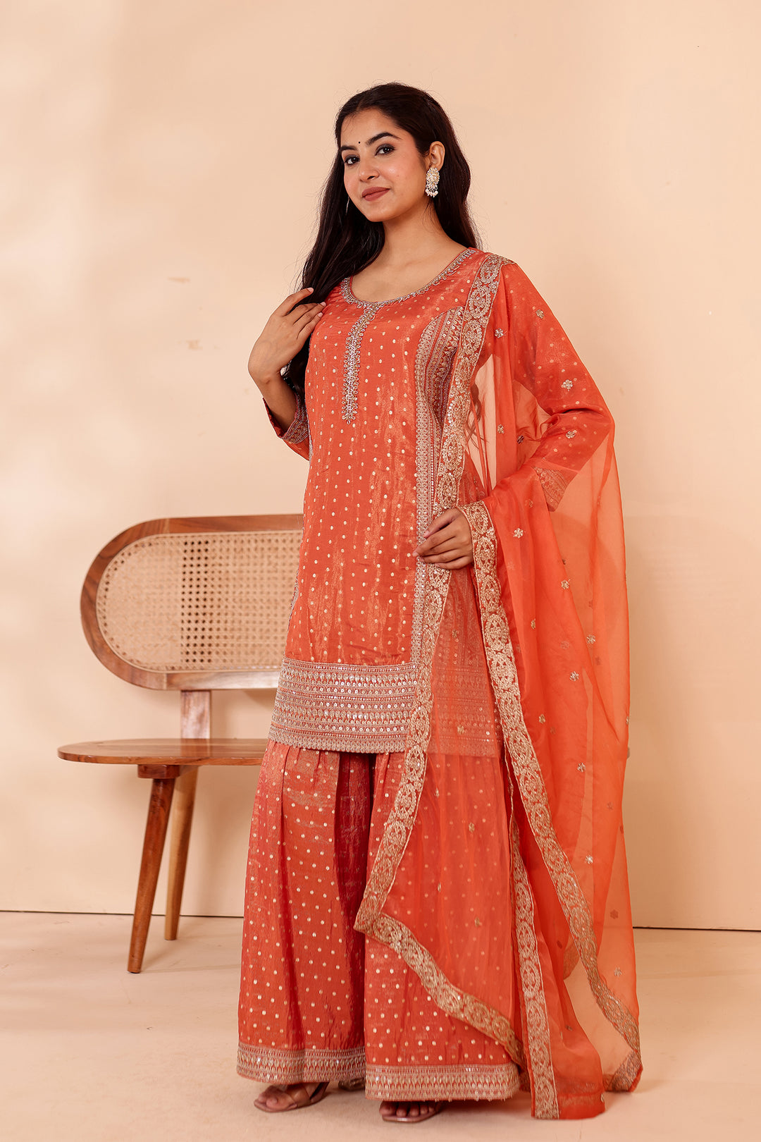 Rust Shimer Butti Sharara Suit.