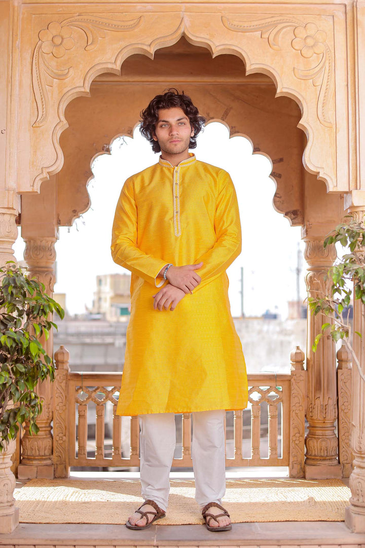 Yellow Brocade Silk Kurta Suit With Gold Zari Work.