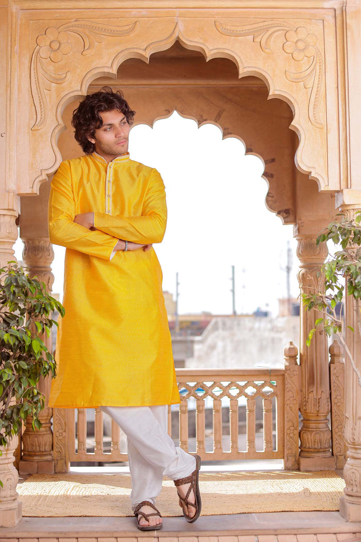 Yellow Brocade Silk Kurta Suit With Gold Zari Work.