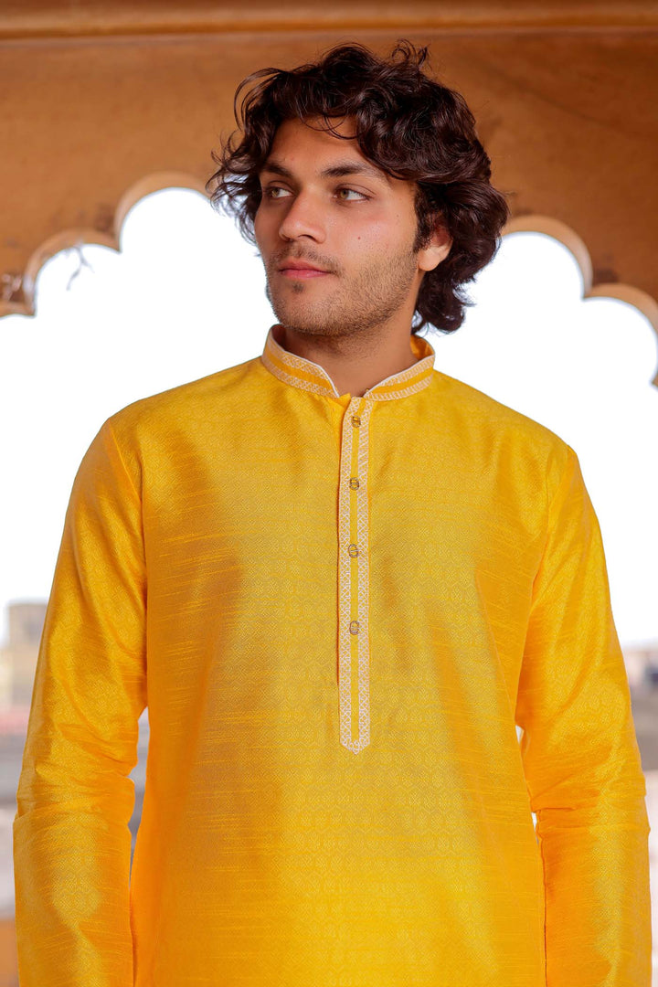 Yellow Brocade Silk Kurta Suit With Gold Zari Work.