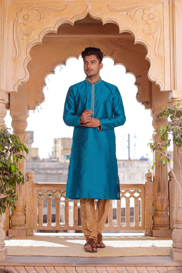 Teal Brocade Silk Kurta Suit With Gold Zari Work.