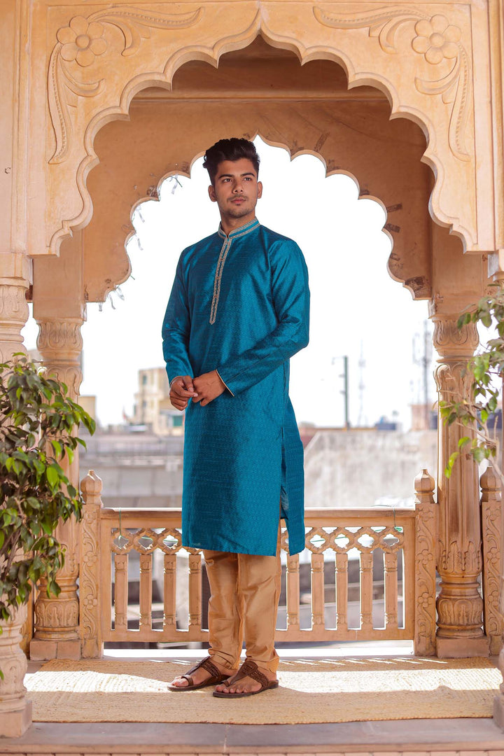 Teal Brocade Silk Kurta Suit With Gold Zari Work.