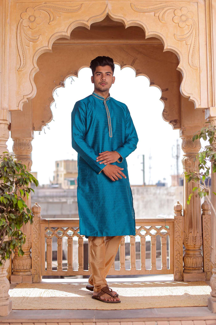 Teal Brocade Silk Kurta Suit With Gold Zari Work.