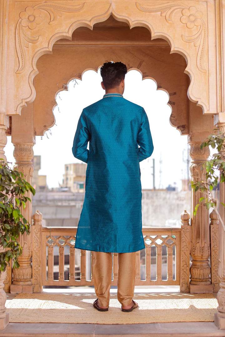 Teal Brocade Silk Kurta Suit With Gold Zari Work.