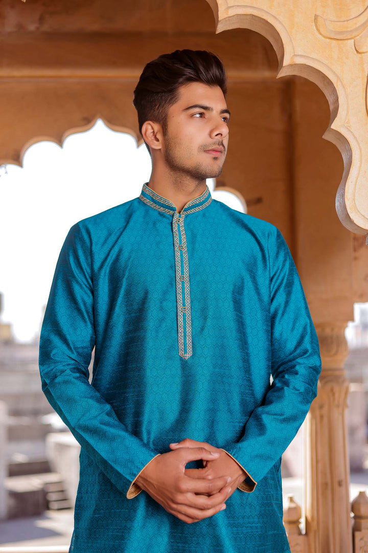 Teal Brocade Silk Kurta Suit With Gold Zari Work.