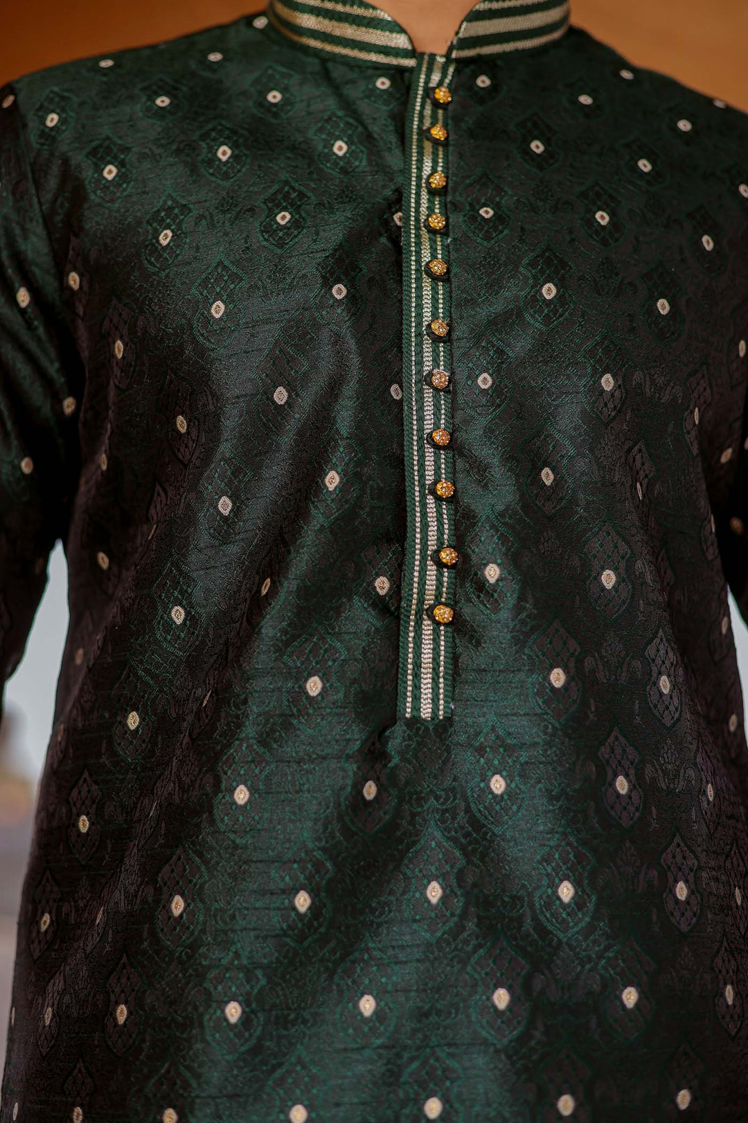 Bottle Green Brocade Silk Kurta Suit adorned with golden butti.