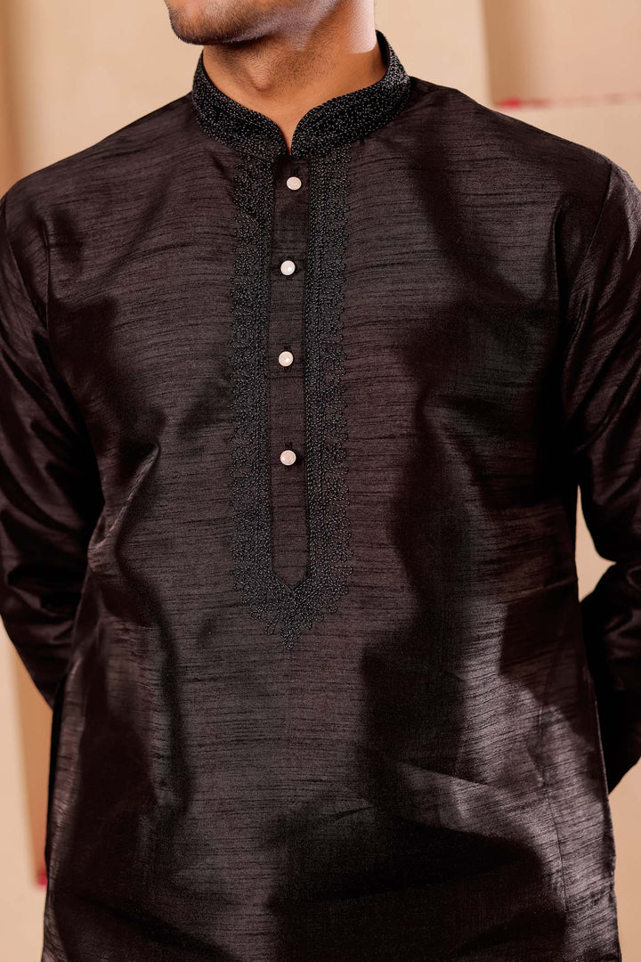 Black Raw Silk Kurta Suit with Intricate work on neckline.