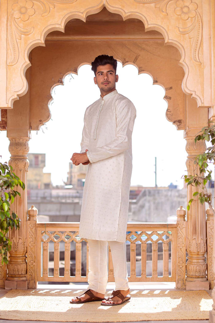 Off White Brocade Silk Kurta suit with resham thread embroidery.