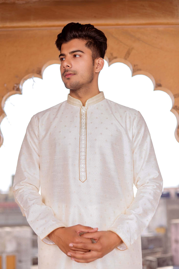 Off White Brocade Silk Kurta suit with resham thread embroidery.