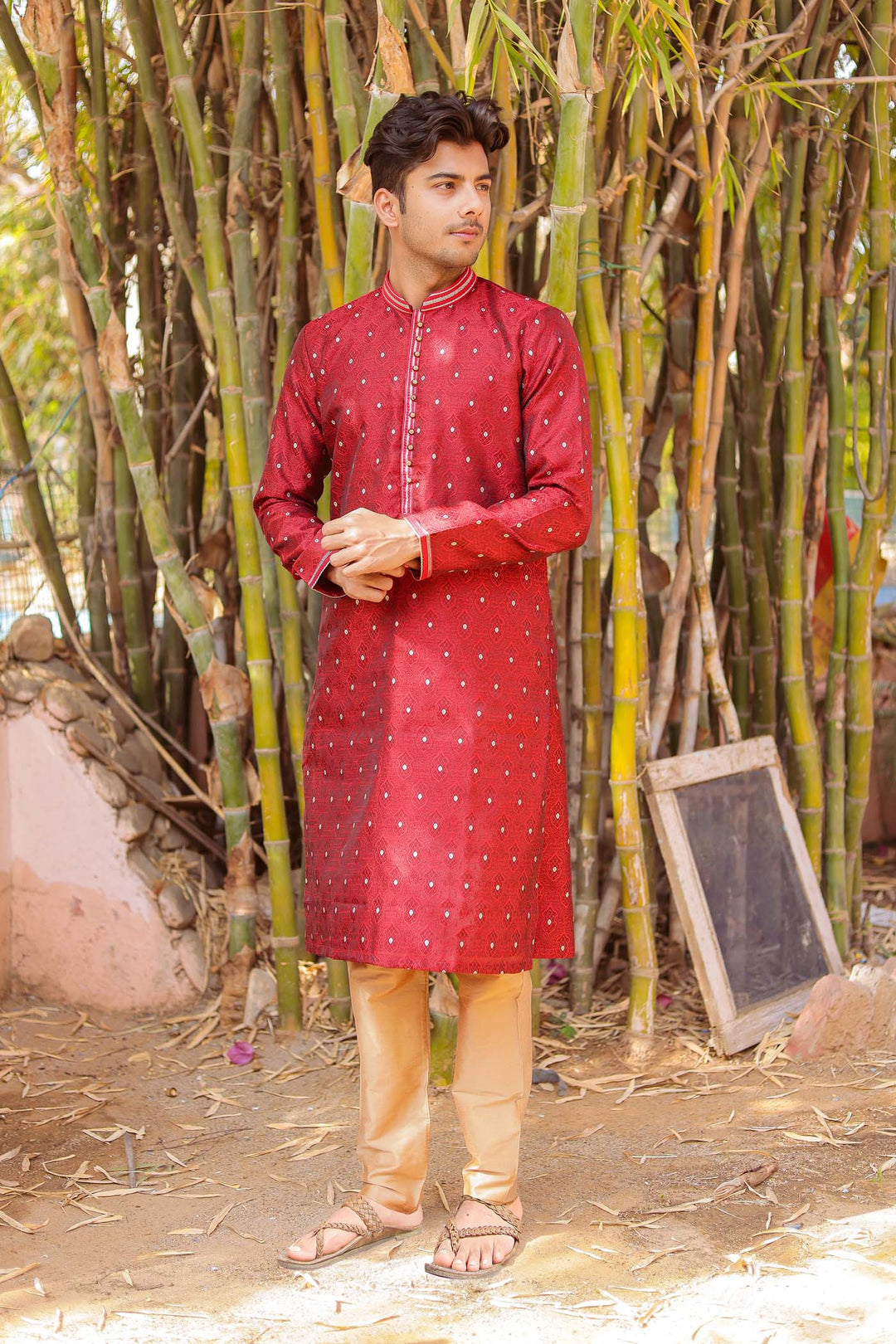 Maroon Brocade Silk Kurta Suit adorned with golden butti.