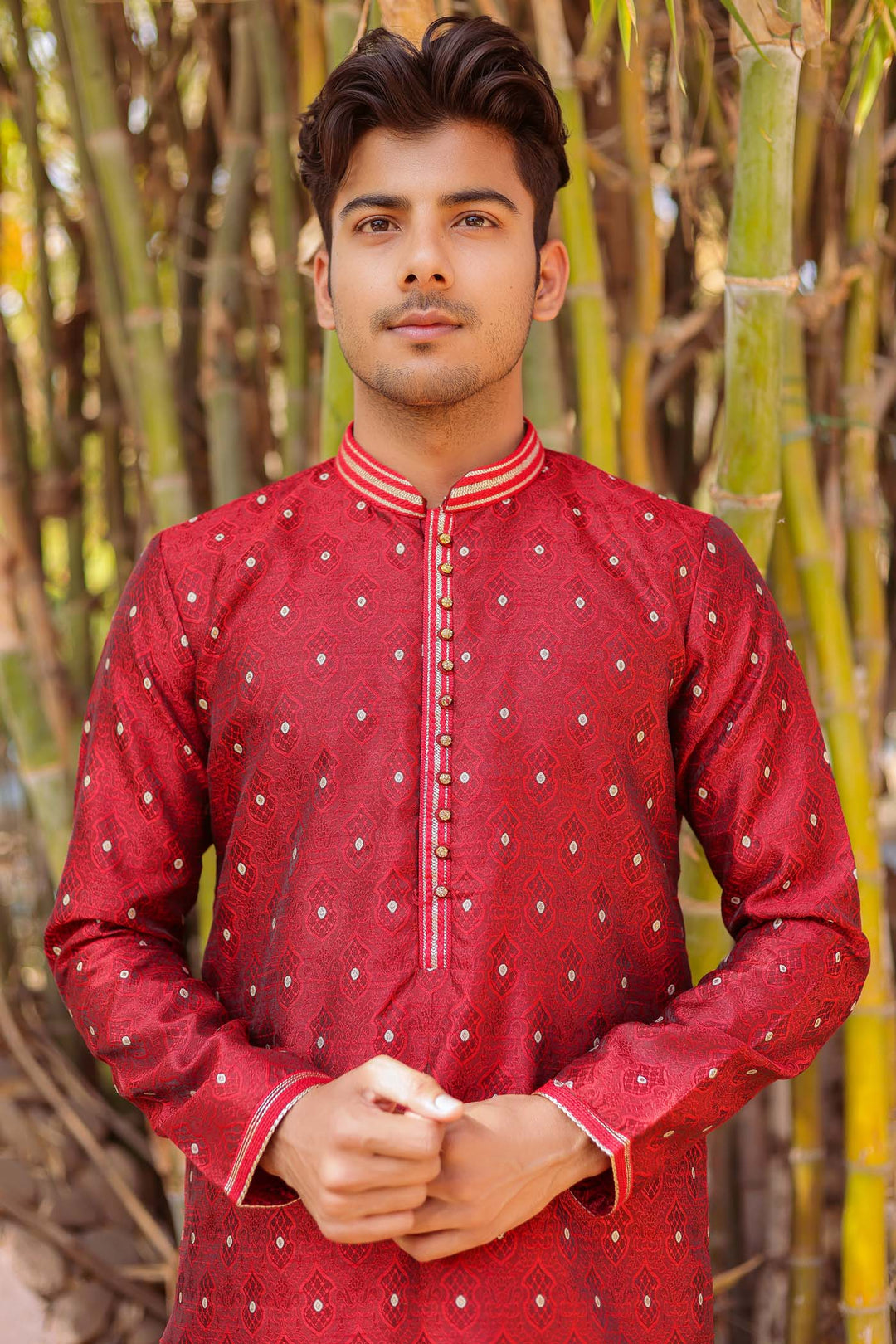 Maroon Brocade Silk Kurta Suit adorned with golden butti.