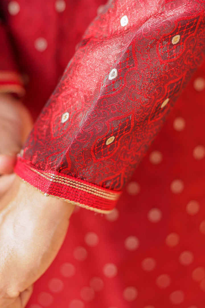 Maroon Brocade Silk Kurta Suit adorned with golden butti.