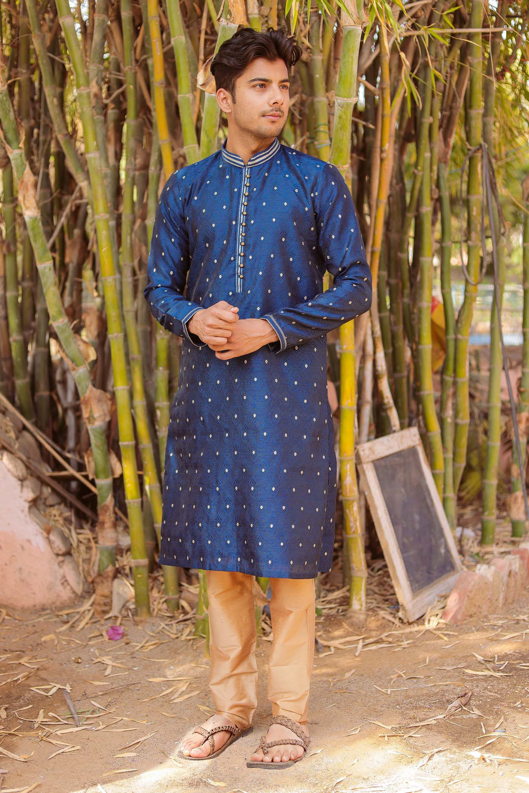 Midnight Blue Brocade Silk Kurta Suit adorned with golden butti.