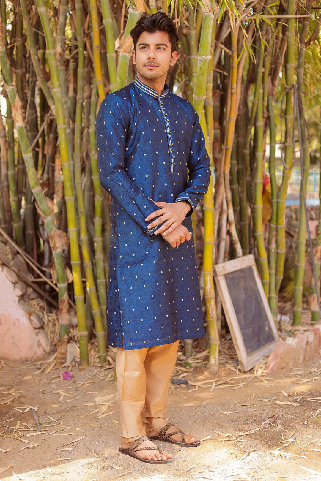 Midnight Blue Brocade Silk Kurta Suit adorned with golden butti.