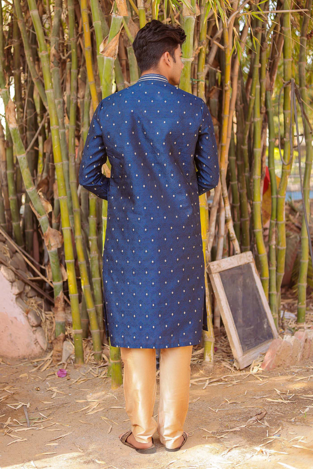 Midnight Blue Brocade Silk Kurta Suit adorned with golden butti.