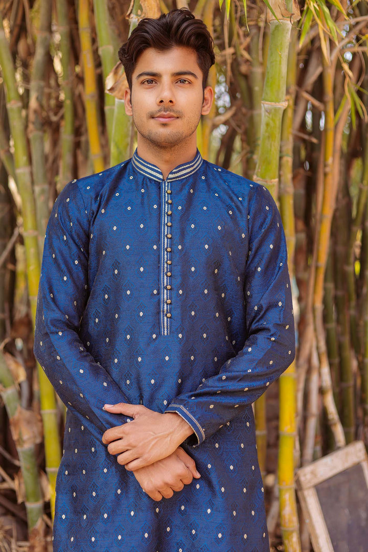 Midnight Blue Brocade Silk Kurta Suit adorned with golden butti.