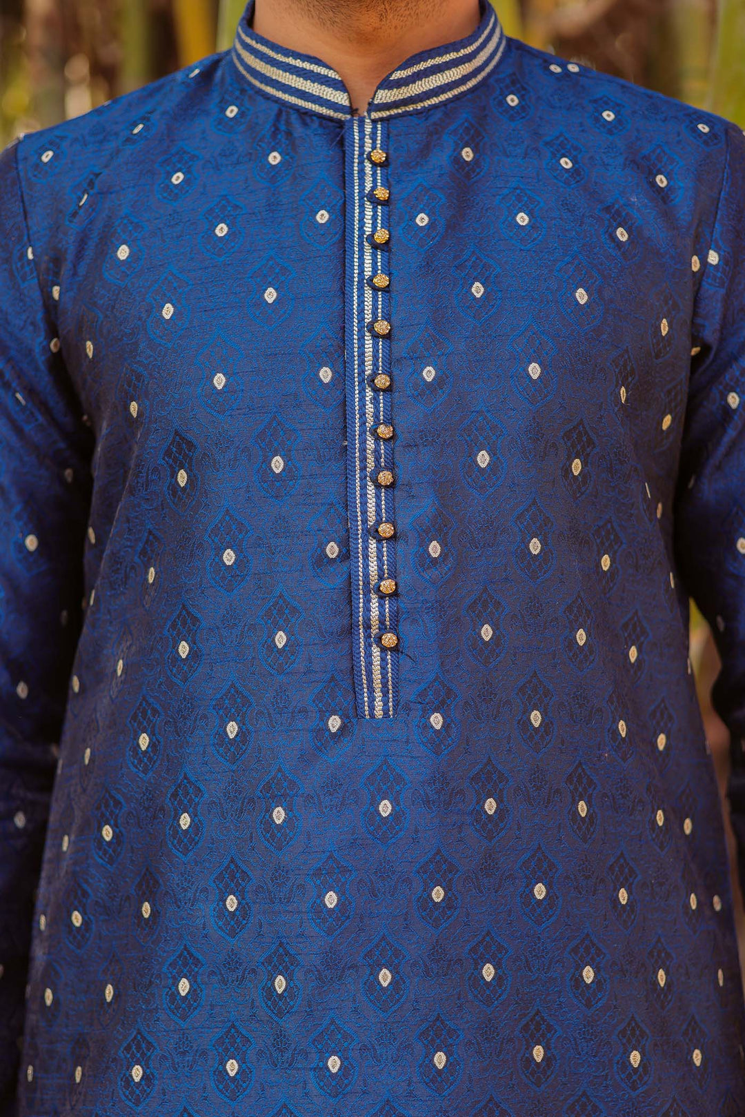 Midnight Blue Brocade Silk Kurta Suit adorned with golden butti.