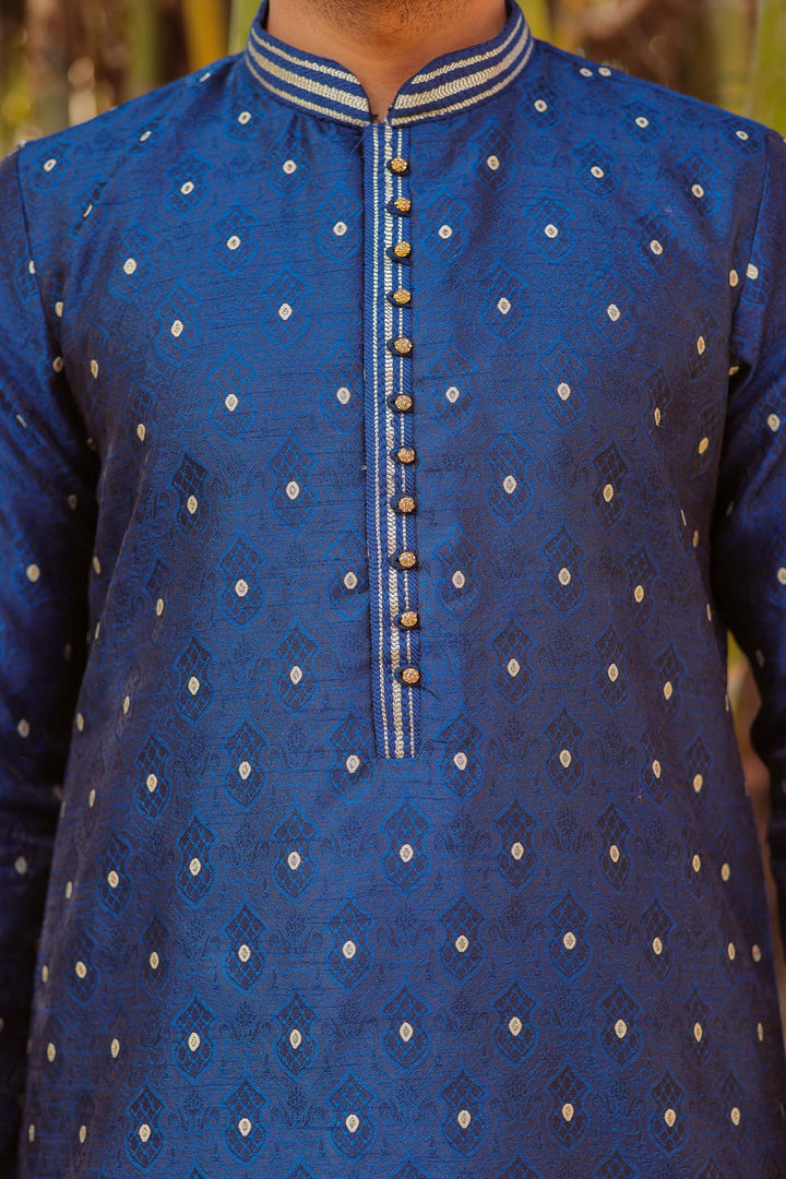 Midnight Blue Brocade Silk Kurta Suit adorned with golden butti.