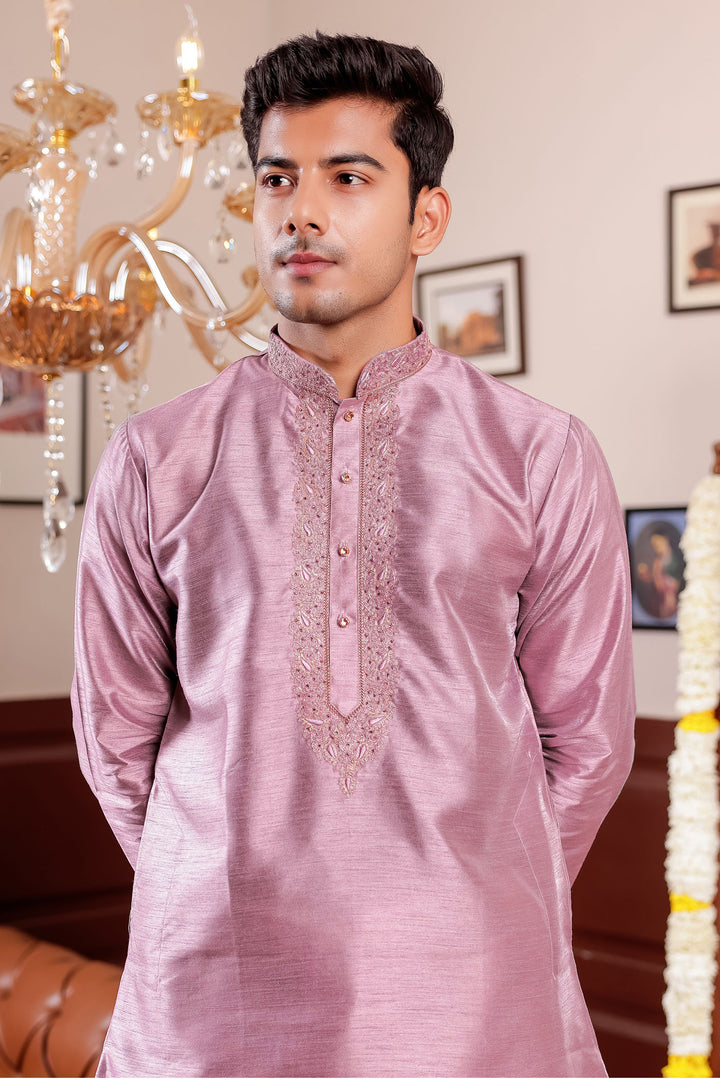 Mauve Raw Silk Kurta Suit with Intricate Embroidery on neckline.